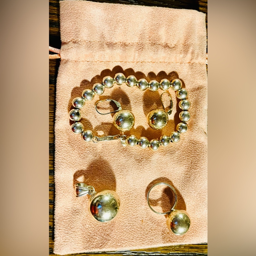 Elegant Sterling Silver Jewelry Set- Bracelet, earrings, ring, and pendant.